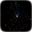 Predominantly black image with points of light in many colors, Orion Nebula, Optical image taken by Hubble Space Telescope
